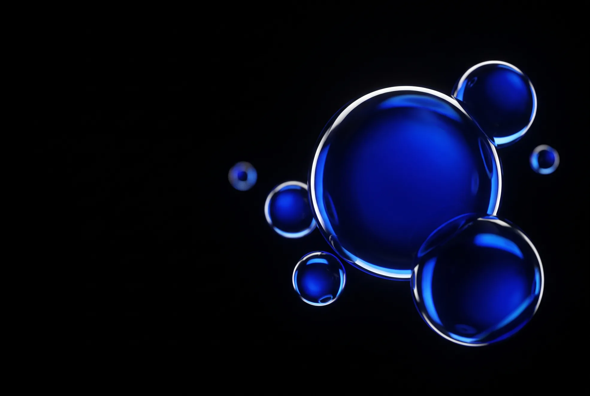 Cluster of luminous glass spheres in cobalt blue light